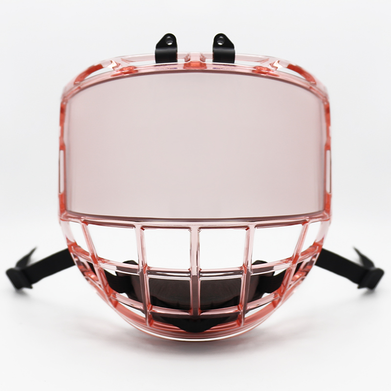 Ice hockey player wearing a protective helmet with a cage